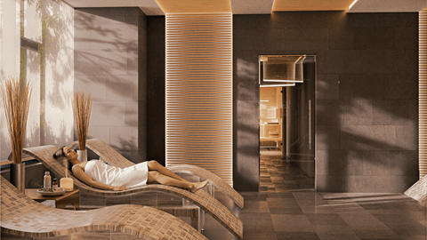 A woman in a white dress is lying on a massage table in a spa.