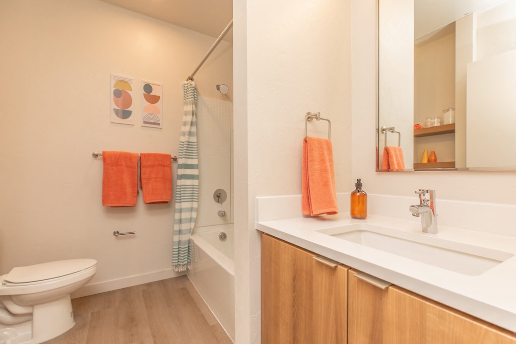 A bathroom with a toilet, sink, and a shower. at The Benedictine, Arizona