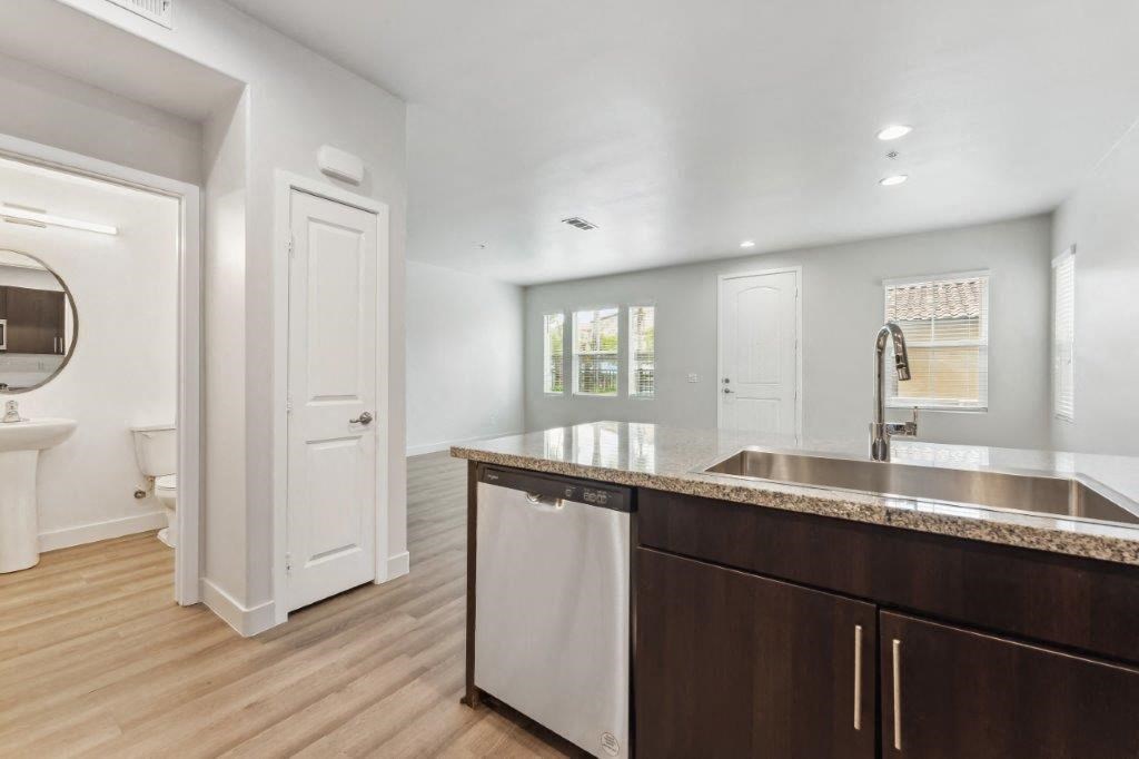 a kitchen with a sink and a counter top