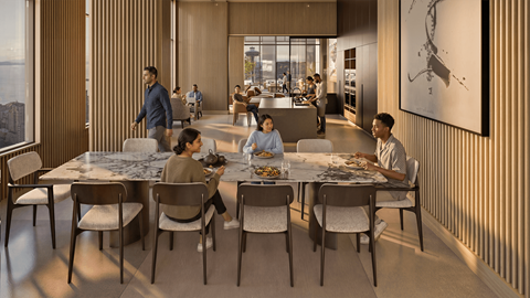 A group of people are sitting around a table in a modern dining room.