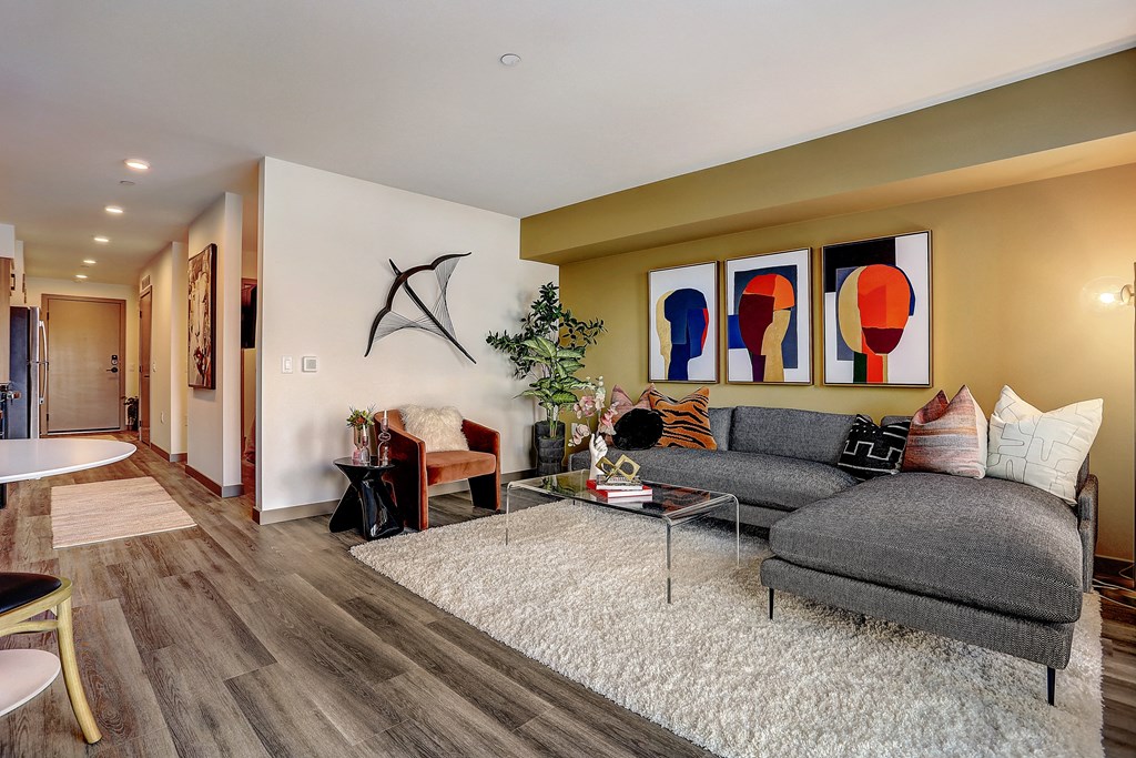 a living room with a couch and a table