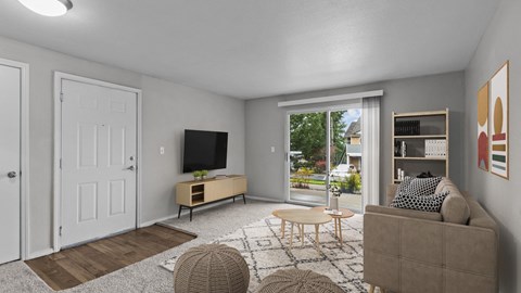 the living room of an apartment with a couch and a tv
