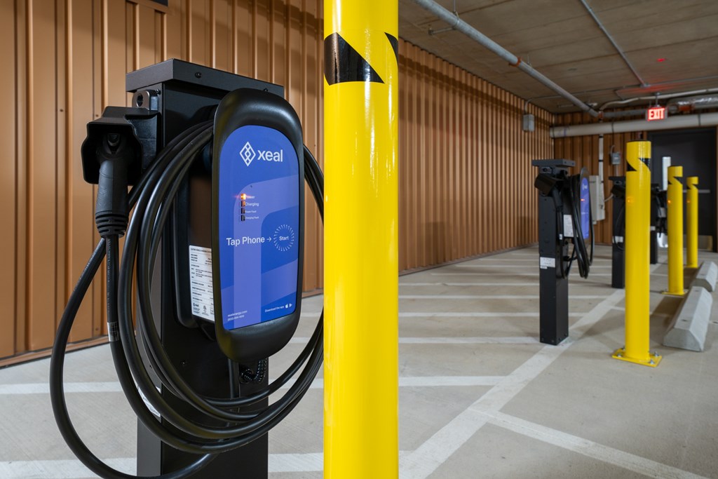 A charging station for electric vehicles is plugged in and charging.