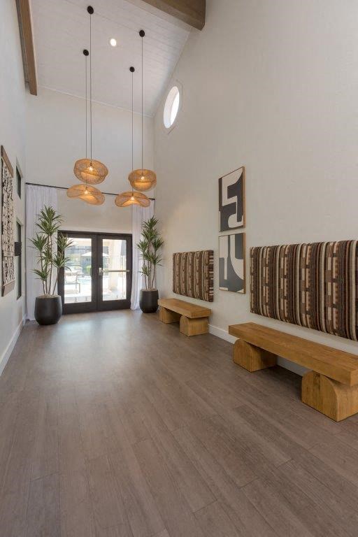 a large room with benches and drums in it