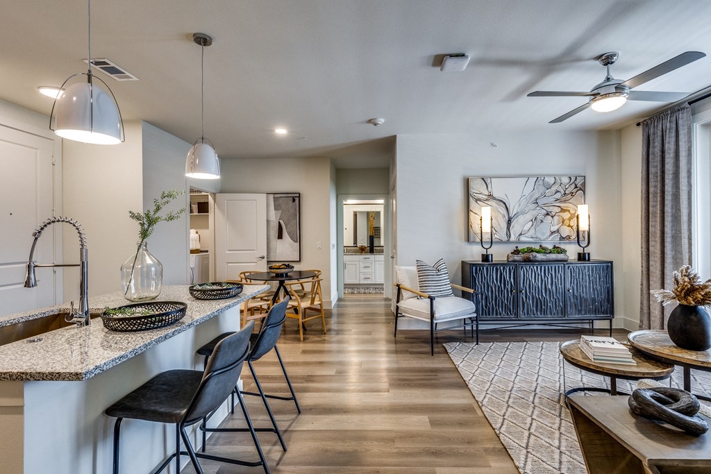 a living room with a kitchen and a dining room