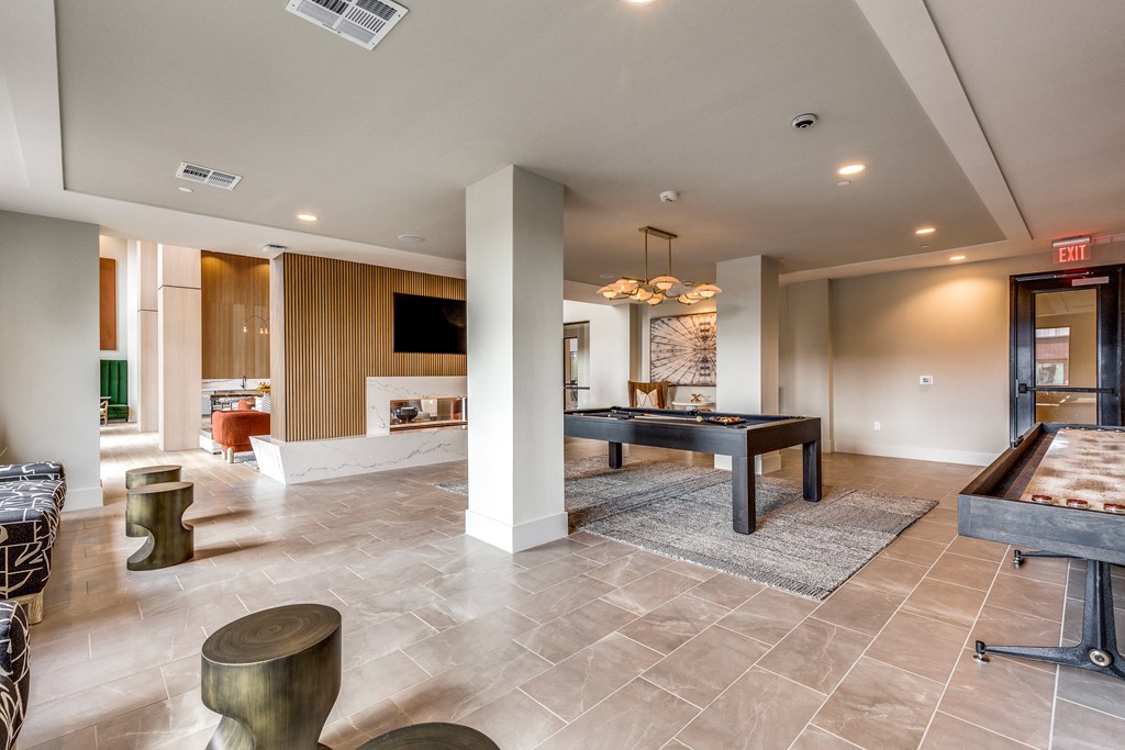 a game room with a ping pong table and a pool table