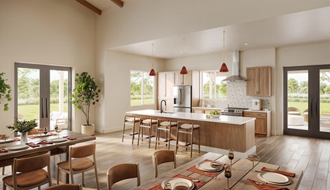 A modern kitchen with a dining table set for a meal.