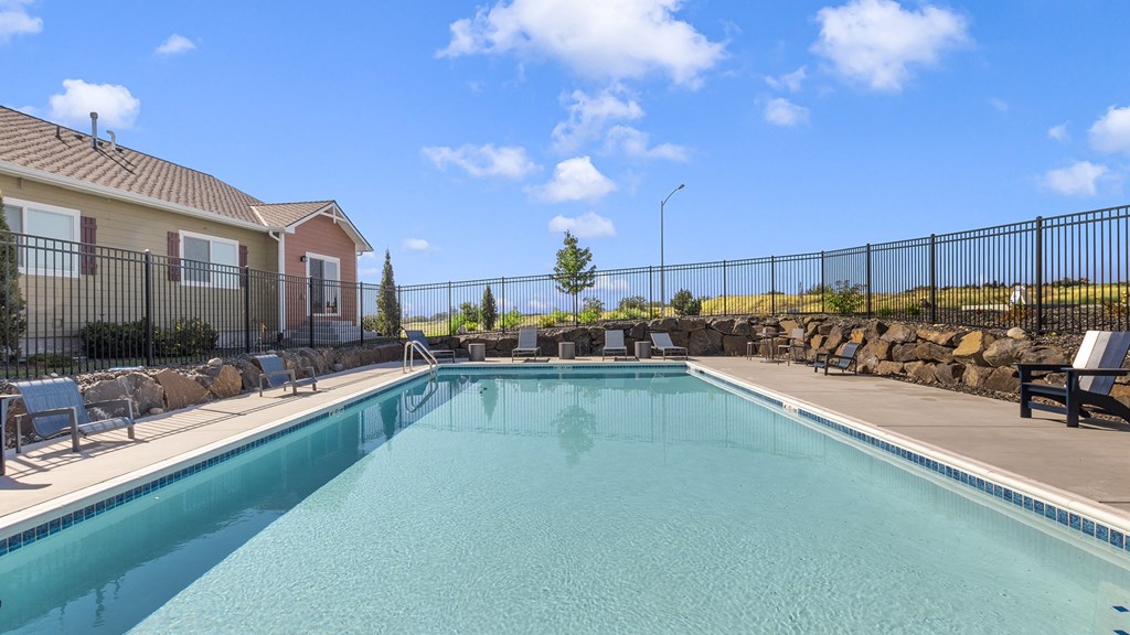 The Tides at Willow Pointe Apartments Pool Area and Lounge Chairs