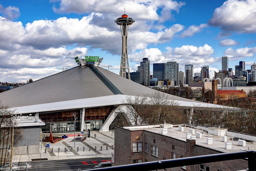 a view of the space needle from the roof of the tacoma dome