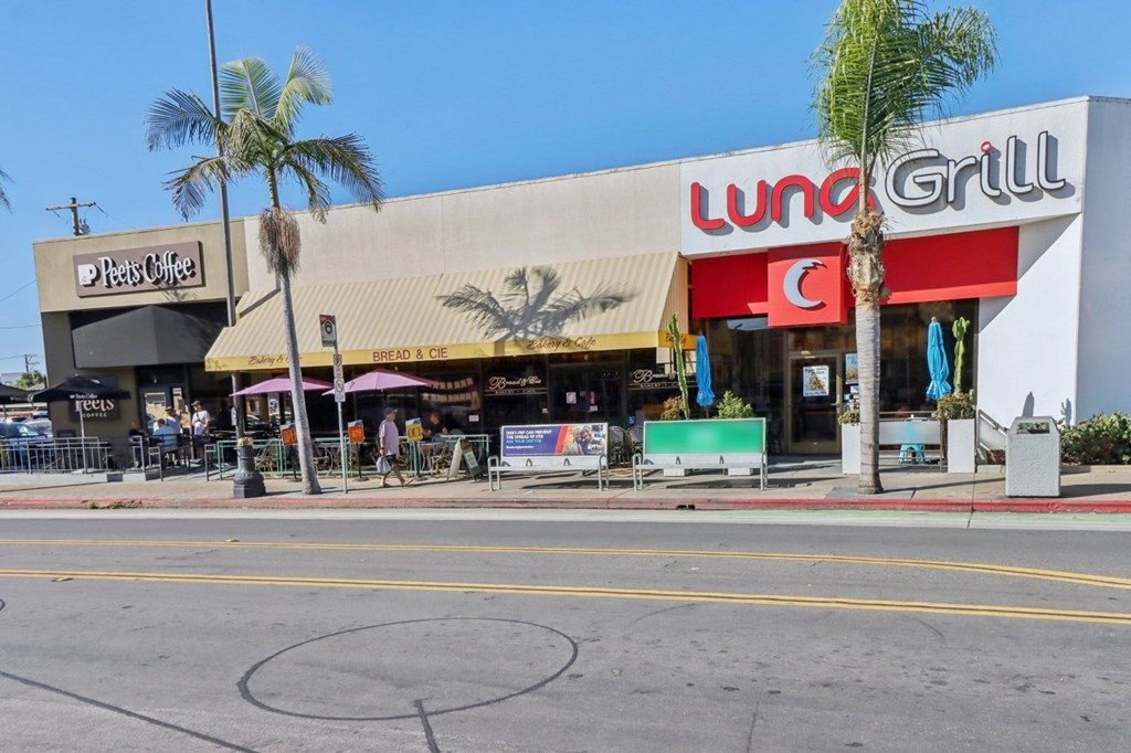 A street view of a Lunch Grill restaurant with a Peet's Coffee shop next to it.