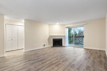 Reserve at Bucklin Hill Apartments Vacant Living Room with Fireplace and Balcony Door Reserve at Bucklin Hill Apartments Vacant Living Room with Fireplace and Balcony Door - Photo Gallery 2