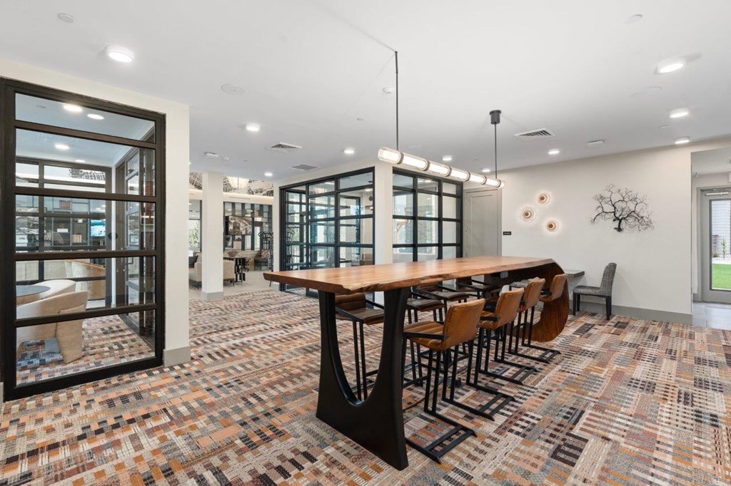a large dining room with a long table and chairs