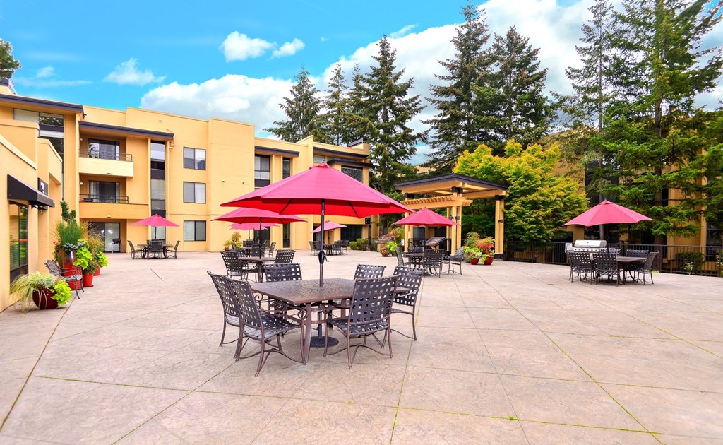 12 Central Square outdoor area with tables and seating and red umbrella