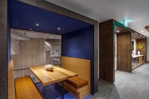 A dining area with a wooden table and bench.