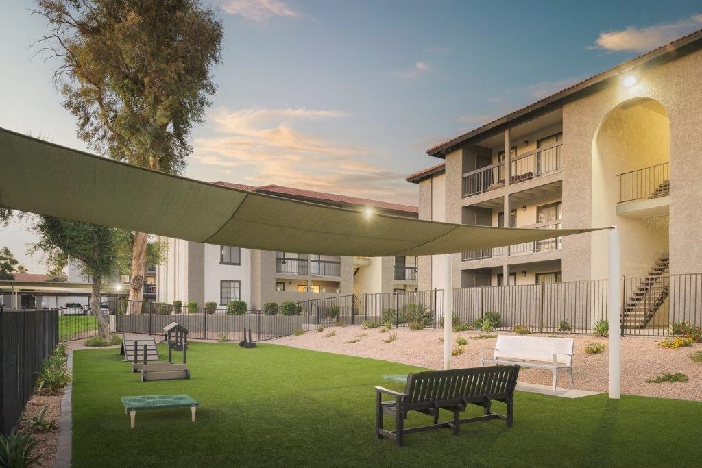 a rendering of a building with a courtyard and benches