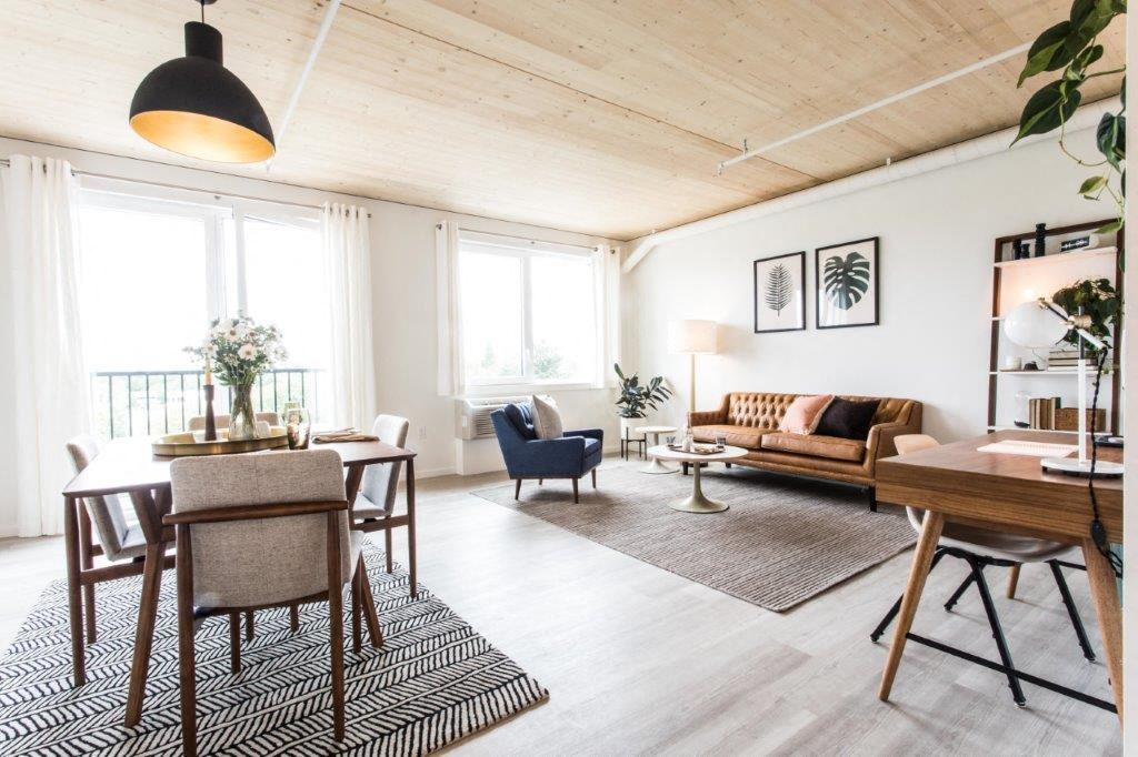 a living room and dining room with a couch and a table