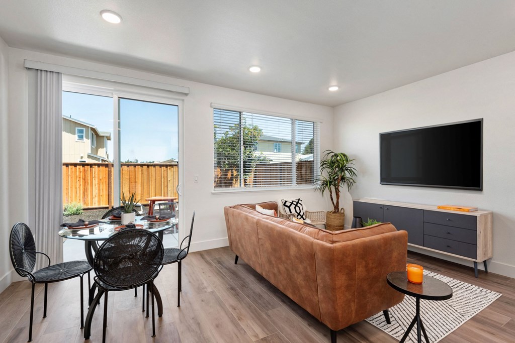 a living room with a couch and a table and a television