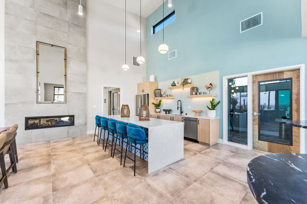 a kitchen and dining room with a bar and a fireplace