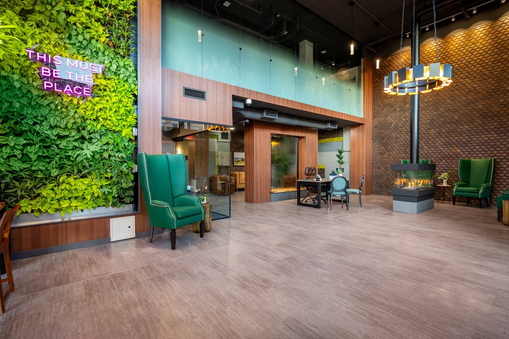 A living wall with a sign that says "This must be the place".