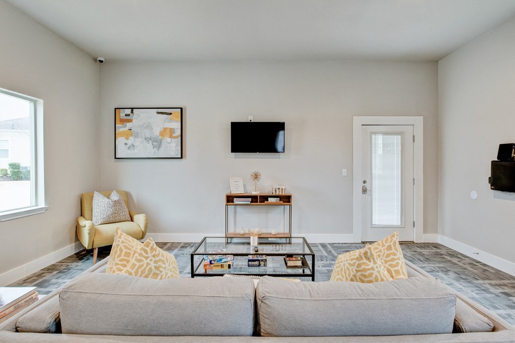Horizon at Premier apartment interior living room with plush couch and TV mounted