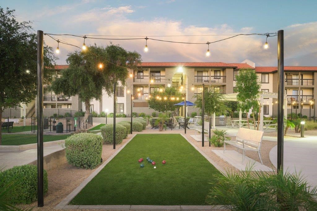 an artist s impression of the courtyard of an apartment complex