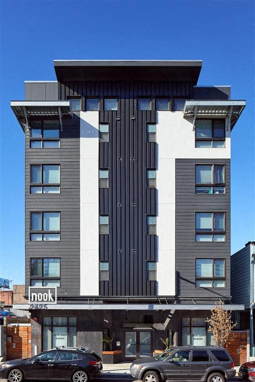 a tall building with a black and white facade