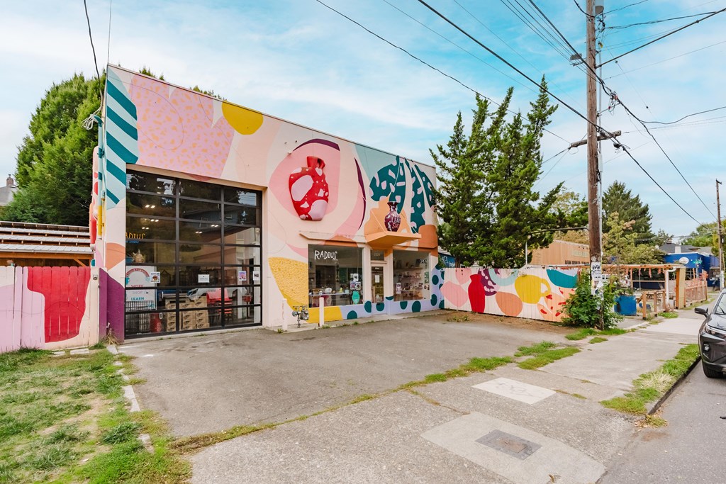 A colorful building with a mural on the side.