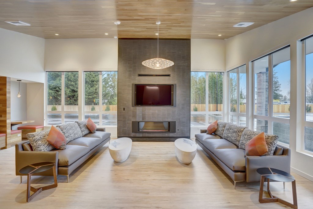 a living room with couches and a fireplace