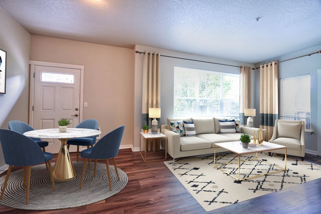 a living room with a couch and a table and chairs