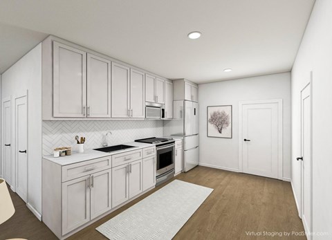 A modern kitchen with white cabinets and appliances.