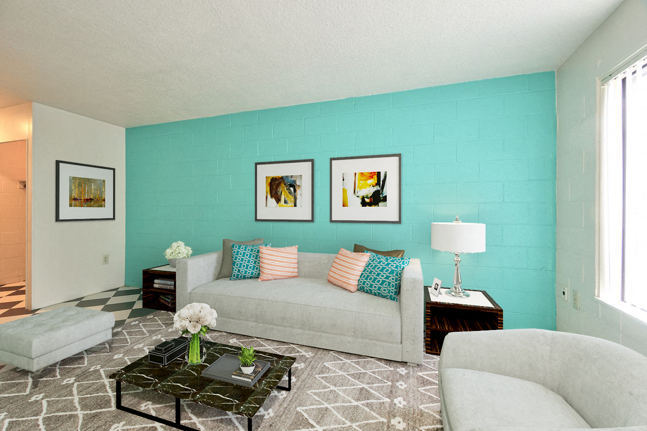 a living room with a couch and a turquoise wall