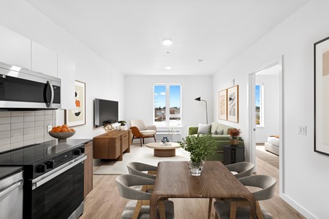A modern kitchen with a dining table and chairs.