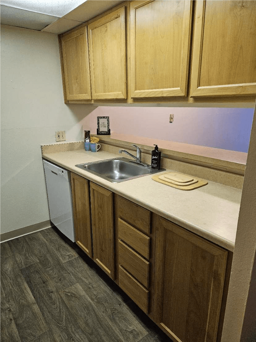 Ventana Apartment kitchen with brown cabinets