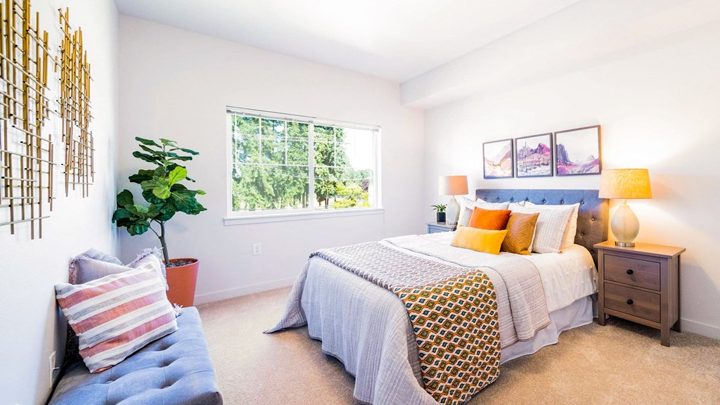 2 Bedroom room with bed and plant