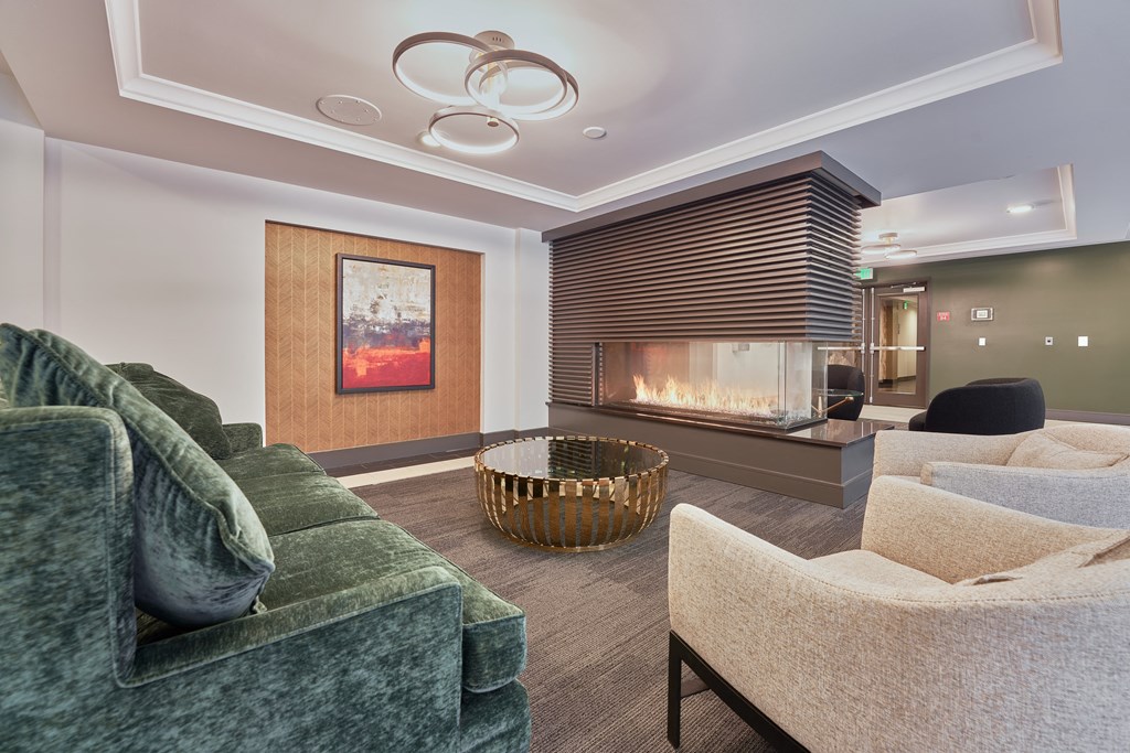 a living room with couches and a fireplace