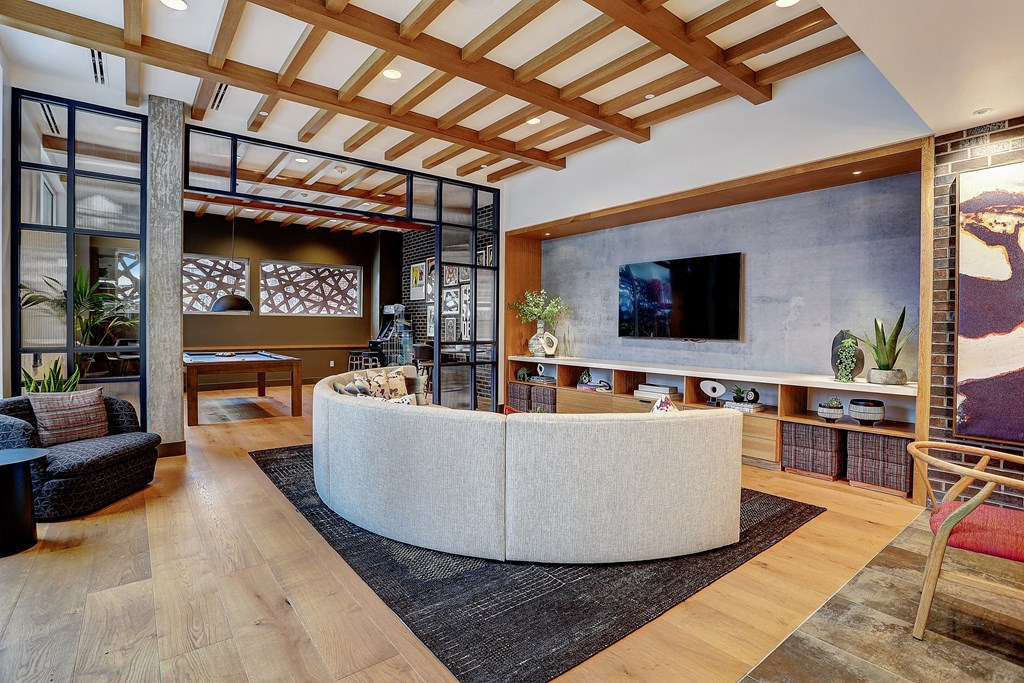 a living room filled with furniture and a flat screen tv