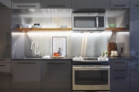 a small kitchen with a stove and a microwave