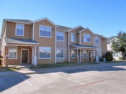a row of houses on the side of a street