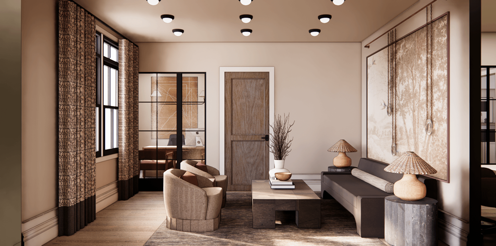 A living room with a grey sofa, a wooden door, and a large painting on the wall.