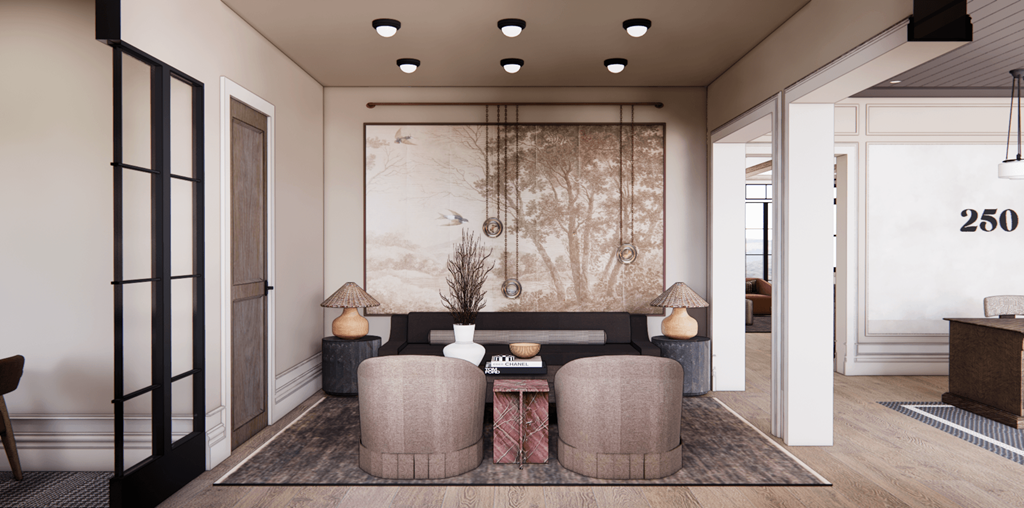 A living room with a large sofa and a wall with a large painting.