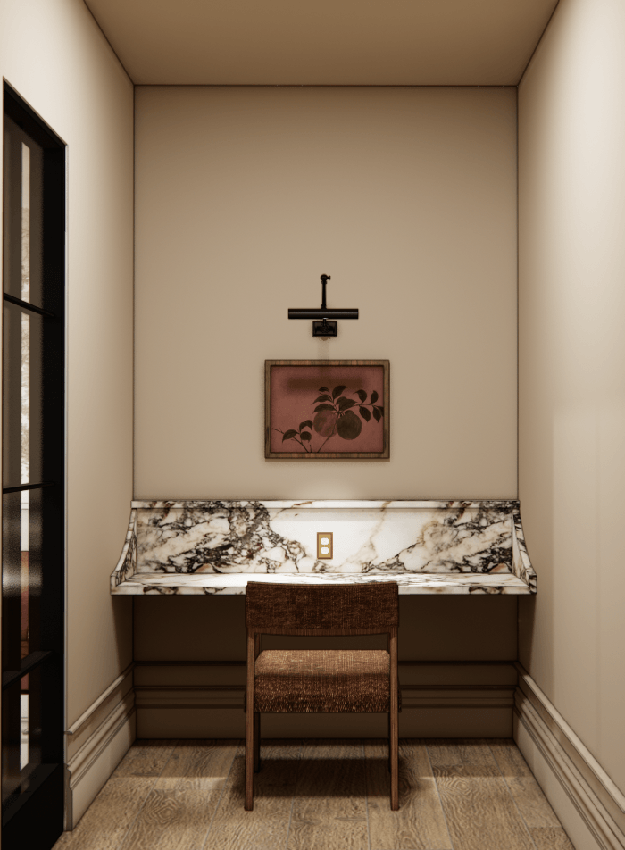 A desk with a chair and a picture on the wall.