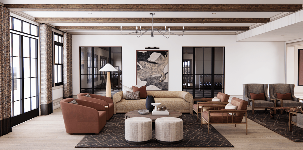 A living room with a large rug and a variety of seating options.