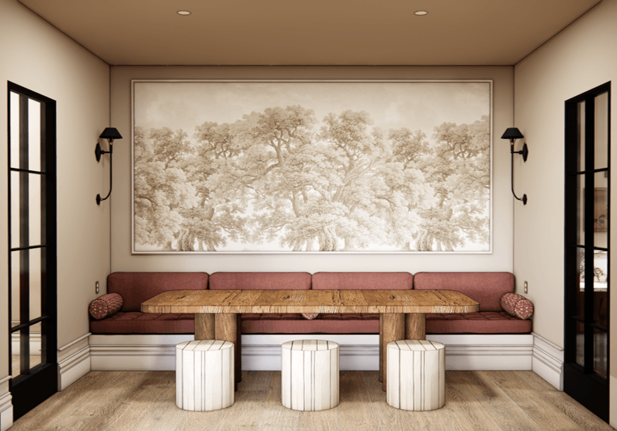 A living room with a red couch and a large tree painting on the wall.