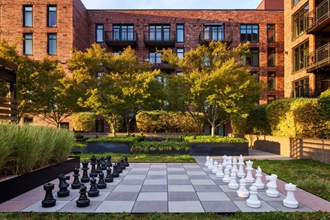A giant chess board in front of a building.