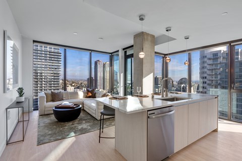 a kitchen and living room with a view of the city