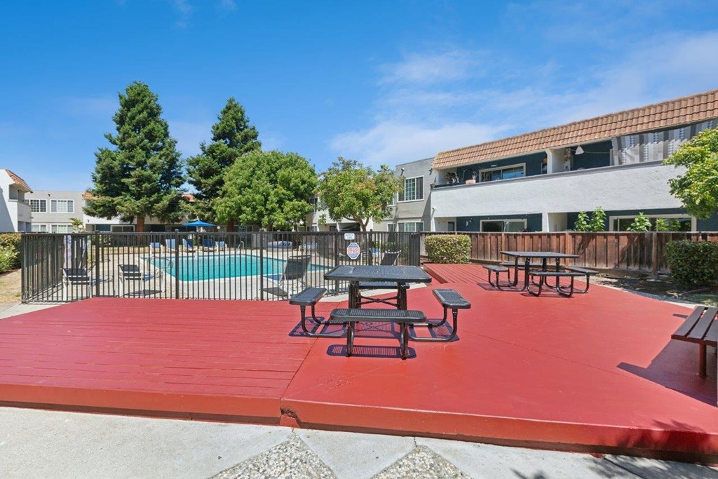 Picnic tables and a pool.