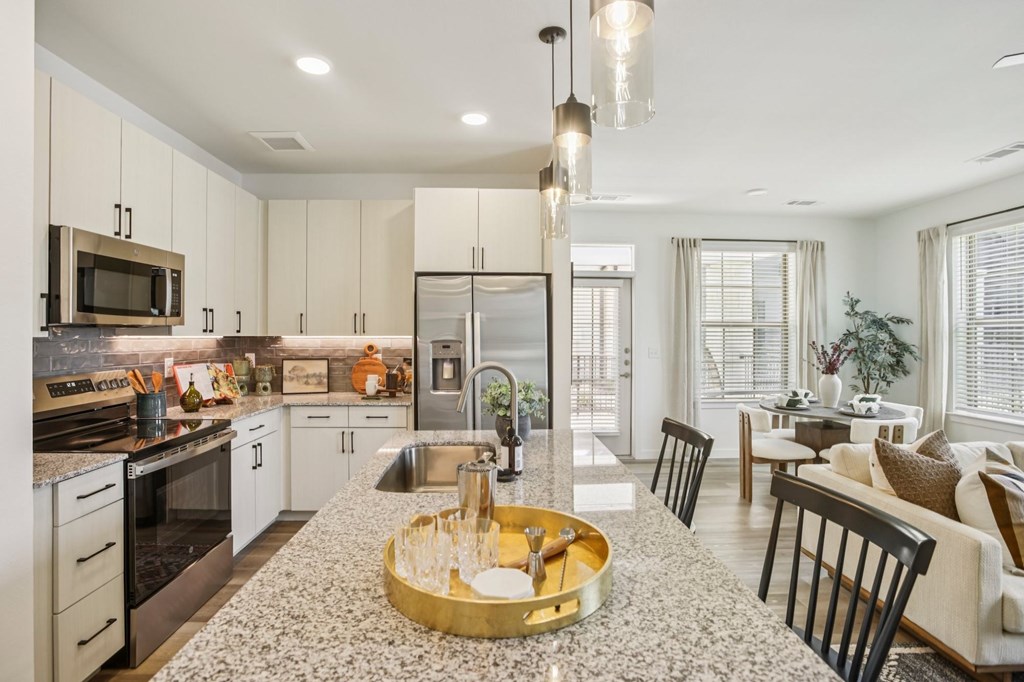 A modern kitchen with a large island in the middle.