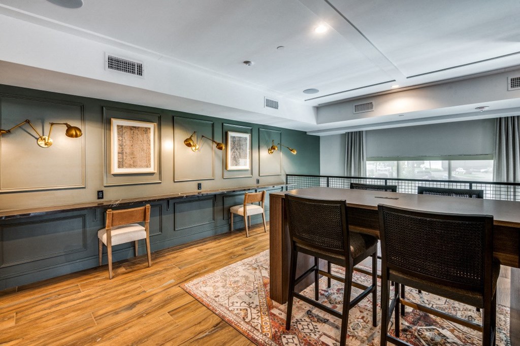 a dining room with a table and chairs and a bar