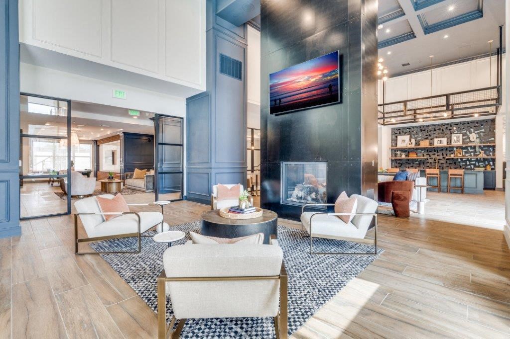 a living room filled with furniture and a fire place