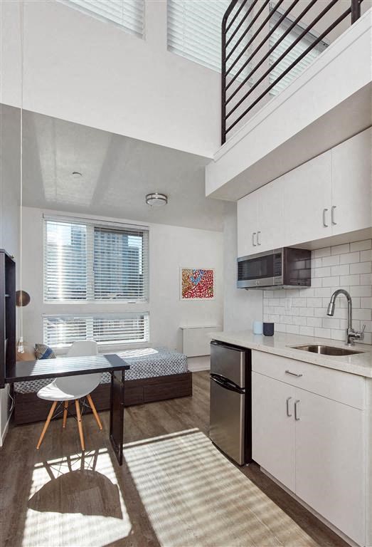 a kitchen and a dining room with a window
